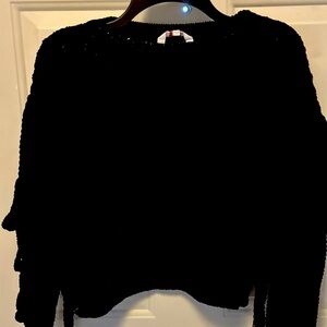 Woman’s waist length sweater